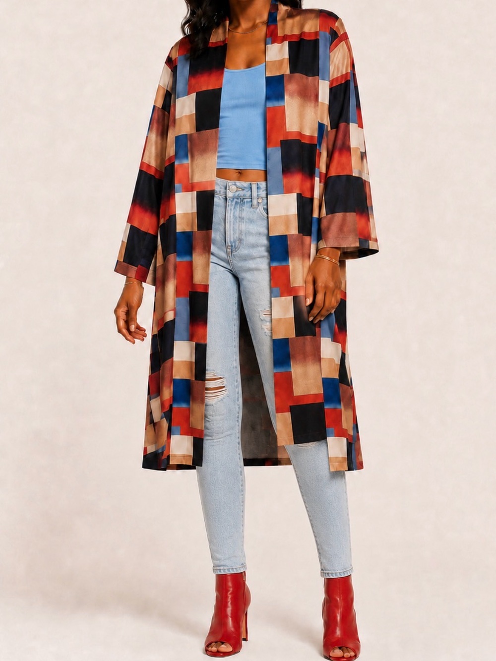 Warm, chic, color-blocked trench coat features a buttoned front.  Soft, warm